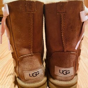 UGG boots toddler size girl 11. Tan with pink ribbon detail and wooly inside.